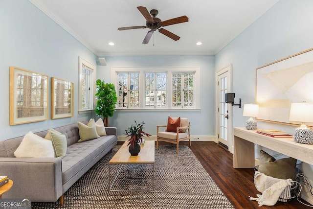 living area featuring recessed lighting, dark wood-type flooring, baseboards, and ornamental molding