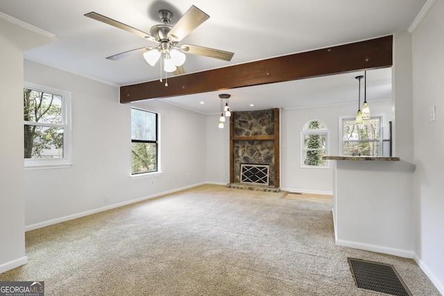 unfurnished living room featuring beamed ceiling, light colored carpet, visible vents, and baseboards