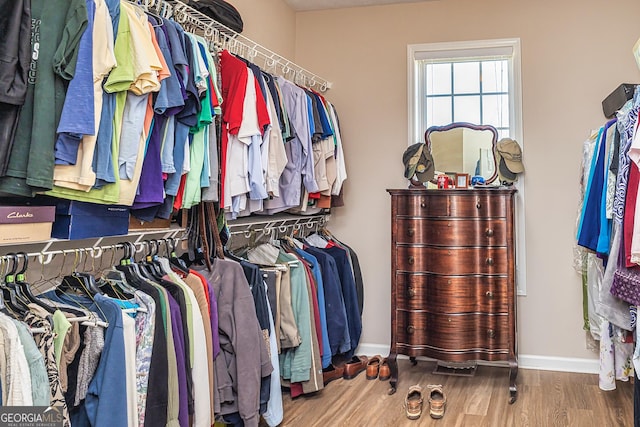 spacious closet with wood finished floors