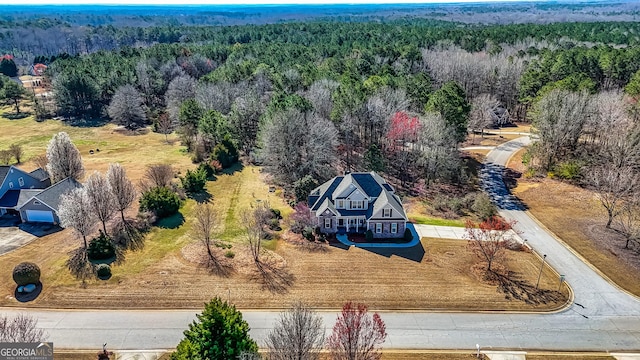 aerial view featuring a view of trees