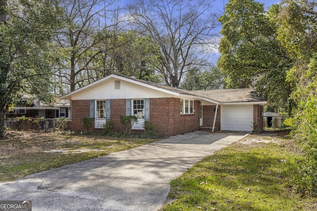 view of side of home with concrete driveway and brick siding