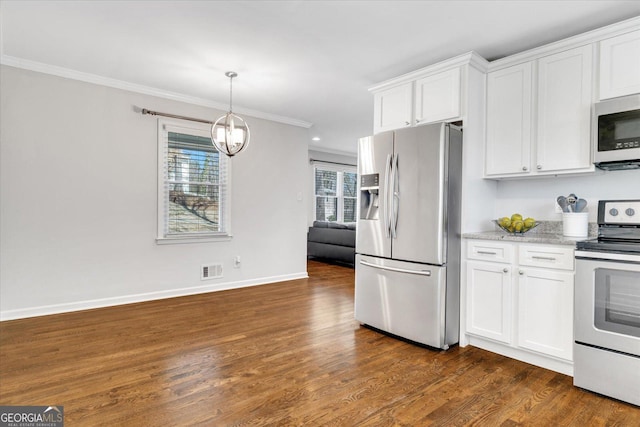 kitchen featuring visible vents, ornamental molding, stainless steel appliances, dark wood-style floors, and white cabinetry