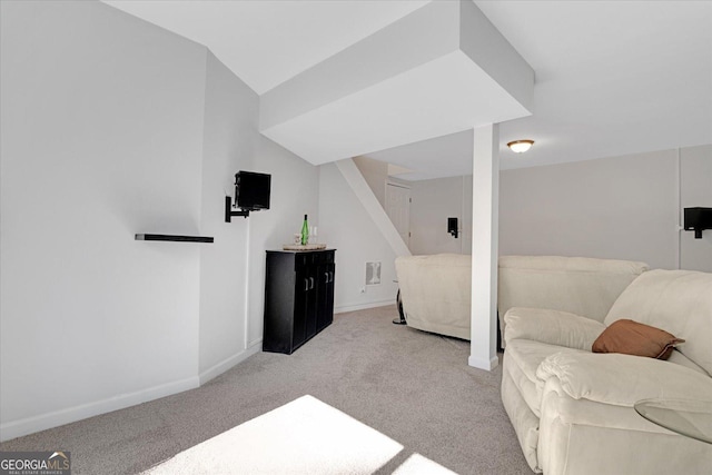 carpeted living room featuring visible vents and baseboards