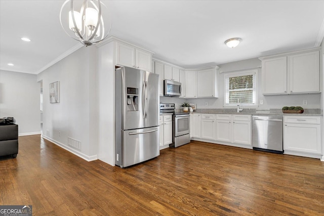 kitchen featuring baseboards, visible vents, dark wood-type flooring, appliances with stainless steel finishes, and white cabinetry