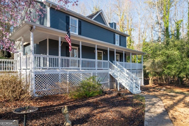 farmhouse with stairway and covered porch