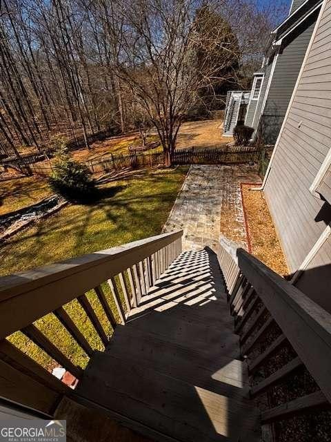 wooden deck featuring a yard