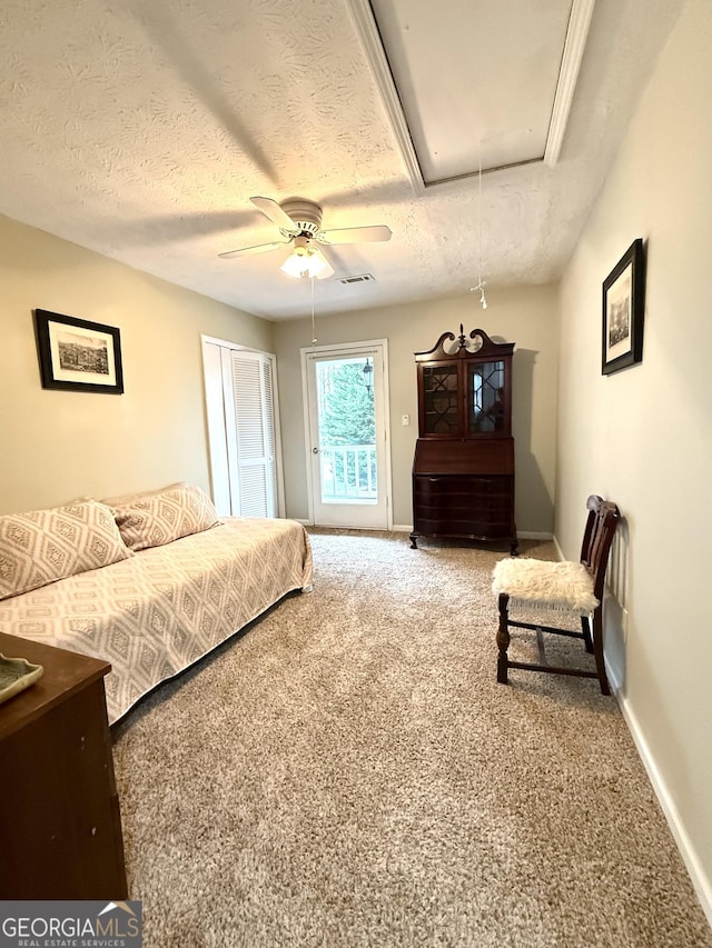 bedroom with carpet floors, baseboards, attic access, and ceiling fan