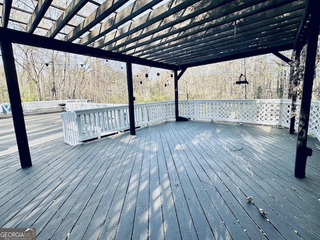 wooden terrace with a pergola