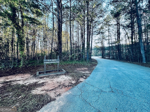 view of street featuring a view of trees