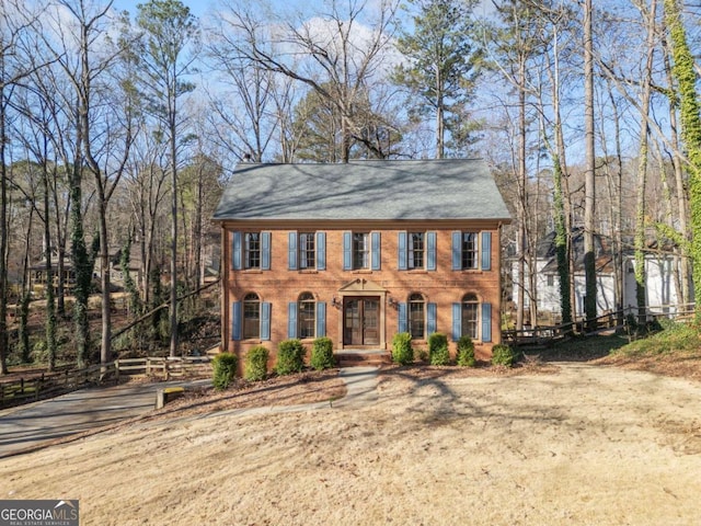 colonial home with brick siding