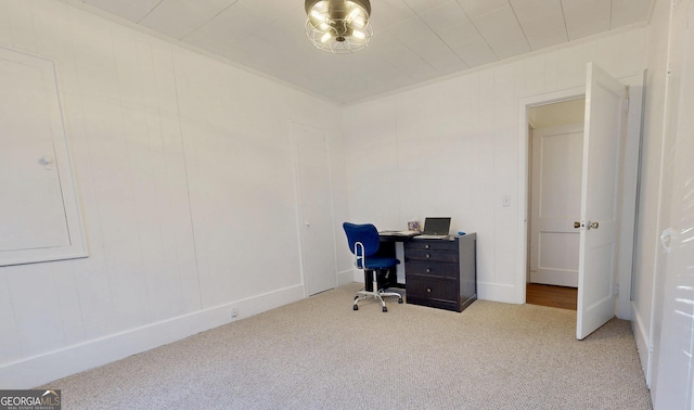 home office with crown molding and light carpet