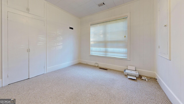 unfurnished bedroom with carpet and visible vents