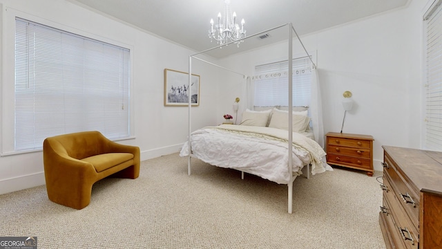 bedroom featuring visible vents, baseboards, a chandelier, light colored carpet, and ornamental molding