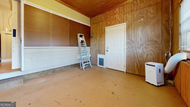garage with wooden walls and wooden ceiling
