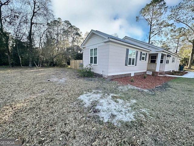 exterior space with crawl space and fence