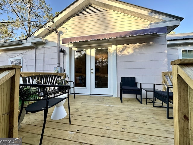 wooden deck featuring french doors