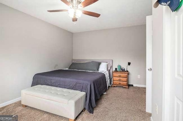 bedroom featuring baseboards and ceiling fan