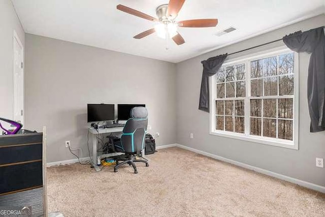 office with visible vents, ceiling fan, baseboards, and carpet floors