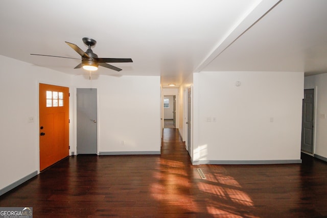 foyer entrance with ceiling fan, baseboards, and wood finished floors