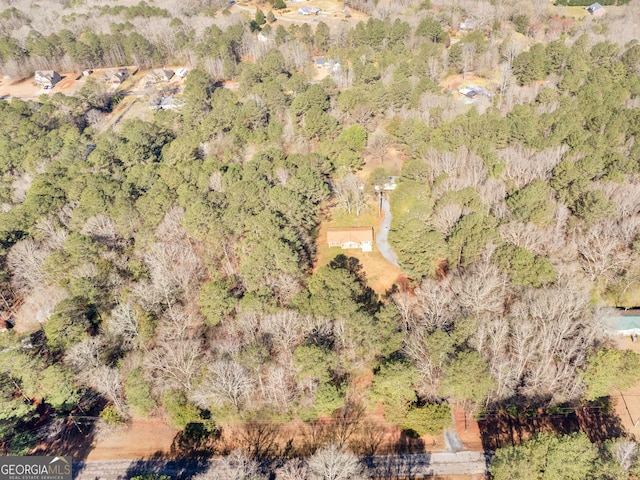 bird's eye view featuring a forest view