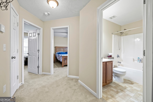 hall featuring baseboards, light colored carpet, visible vents, and a textured ceiling