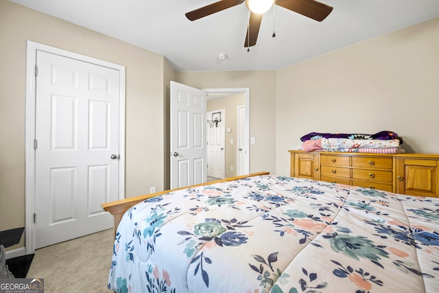 bedroom with carpet flooring, a ceiling fan, and baseboards