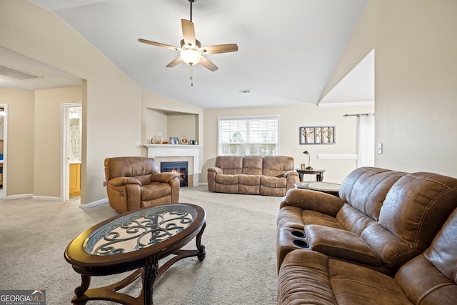 living area with a tiled fireplace, visible vents, light colored carpet, and vaulted ceiling