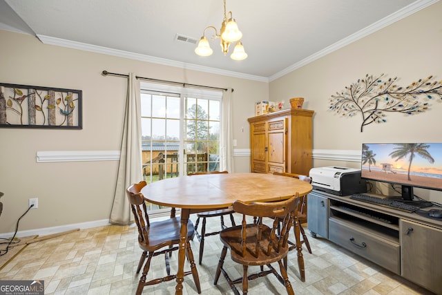 dining space with an inviting chandelier, crown molding, stone finish floor, and baseboards