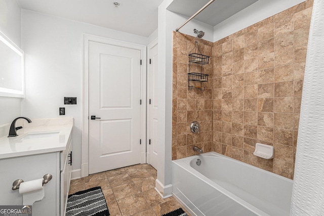 bathroom with shower / bathing tub combination, baseboards, and vanity