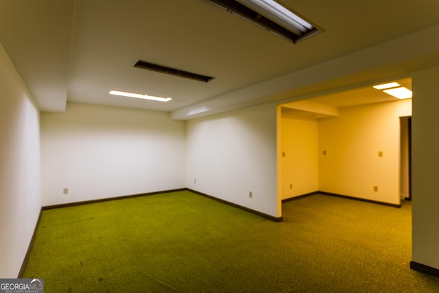 below grade area featuring baseboards and carpet flooring