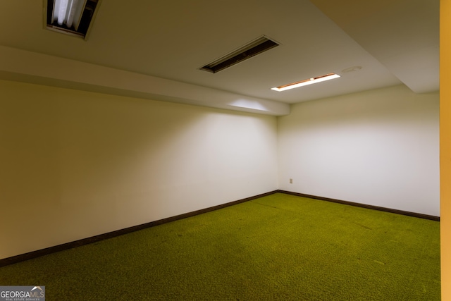 carpeted empty room with baseboards and visible vents