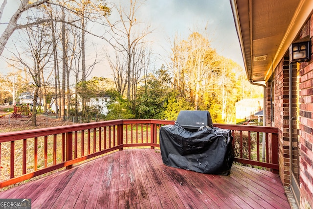 deck featuring a grill