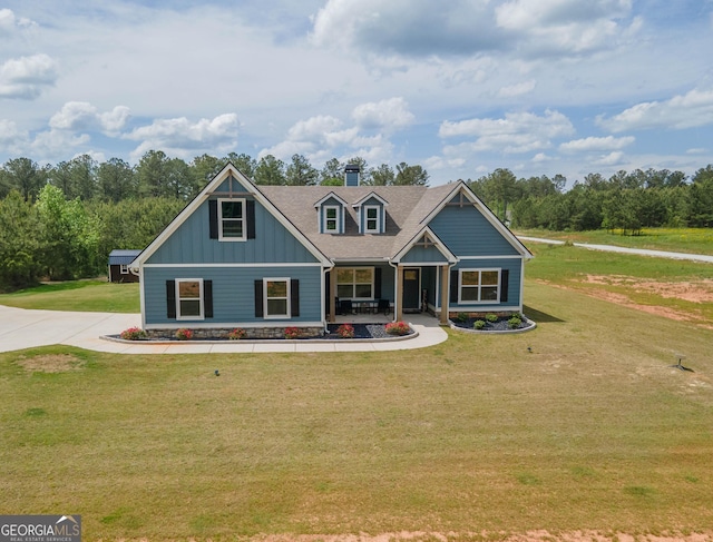 296 Beavers Rd, Grantville, GA 30220 - craftsman inspired home featuring board and batten siding, a porch, a front yard, and a chimney