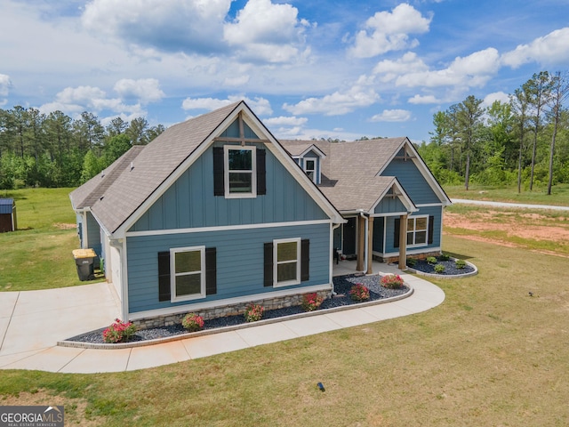 296 Beavers Rd, Grantville, GA 30220 - craftsman-style house featuring board and batten siding, a front yard, a porch, concrete driveway, and a shingled roof