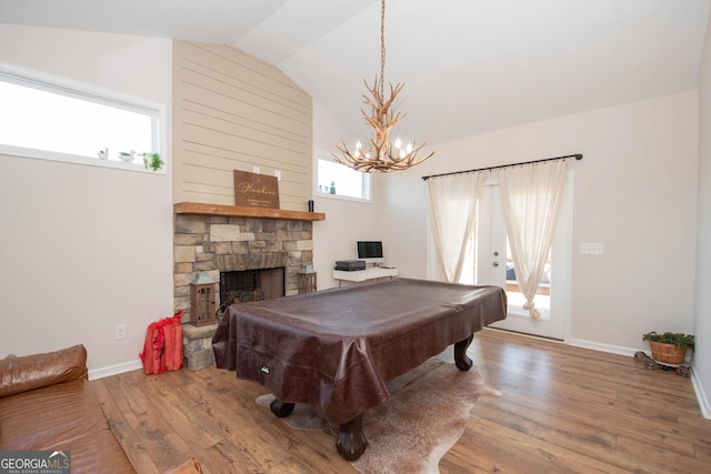 rec room with a fireplace, vaulted ceiling, billiards, and wood finished floors