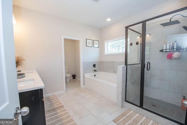 bathroom with toilet, a shower stall, a garden tub, and tile patterned flooring