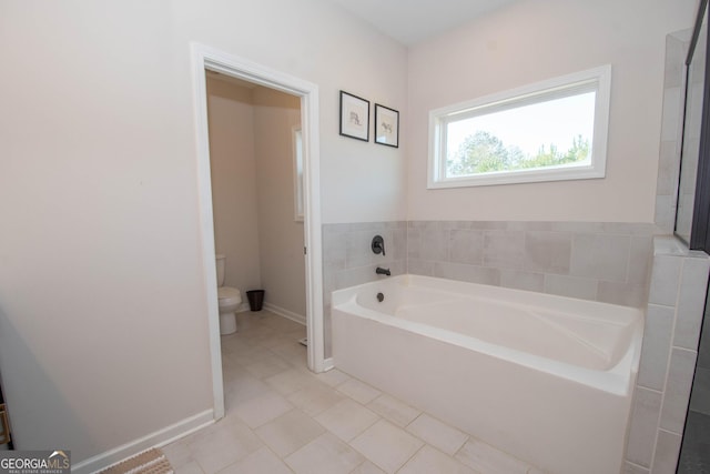 296 Beavers Rd, Grantville, GA 30220 - full bathroom with tile patterned flooring, toilet, a bath, and baseboards