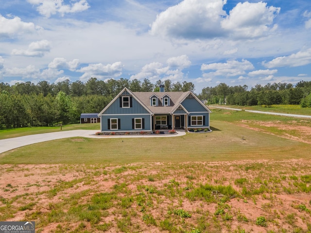 296 Beavers Rd, Grantville, GA 30220 - view of front of home with board and batten siding, a front yard, covered porch, and concrete driveway