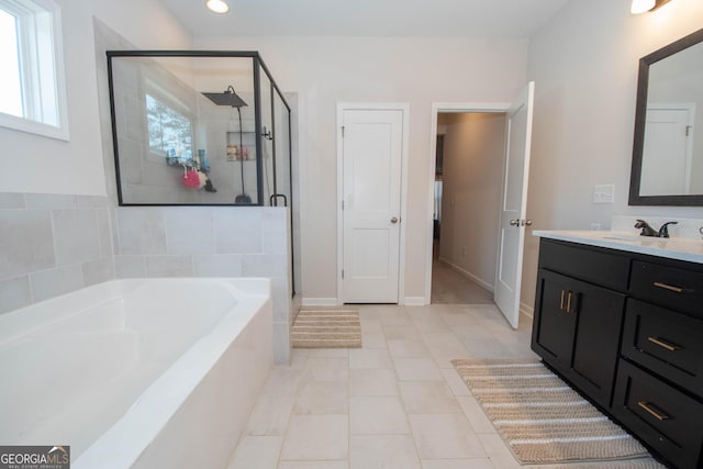 full bathroom featuring vanity, recessed lighting, a stall shower, tile patterned floors, and a bath