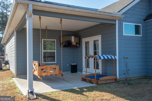 view of patio / terrace with central air condition unit and french doors