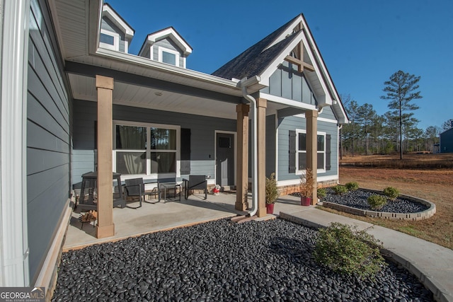 exterior space featuring board and batten siding and a porch