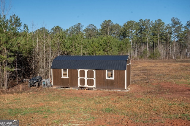 view of shed featuring a forest view