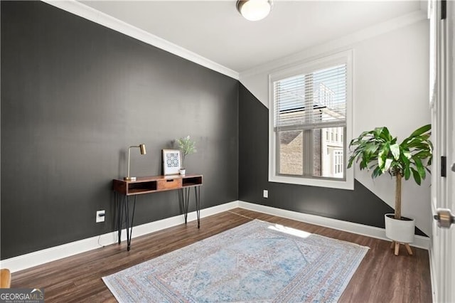 office space with crown molding, wood finished floors, and baseboards