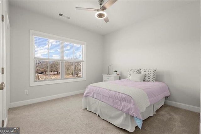 bedroom featuring visible vents, baseboards, carpet, and ceiling fan