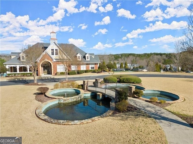 view of home's community featuring a hot tub