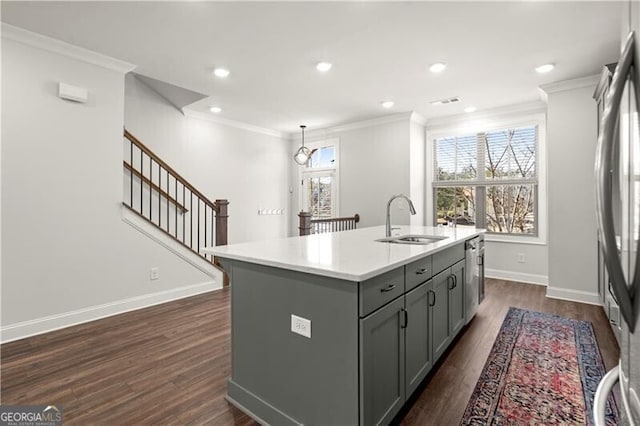 kitchen with a sink, gray cabinetry, and crown molding