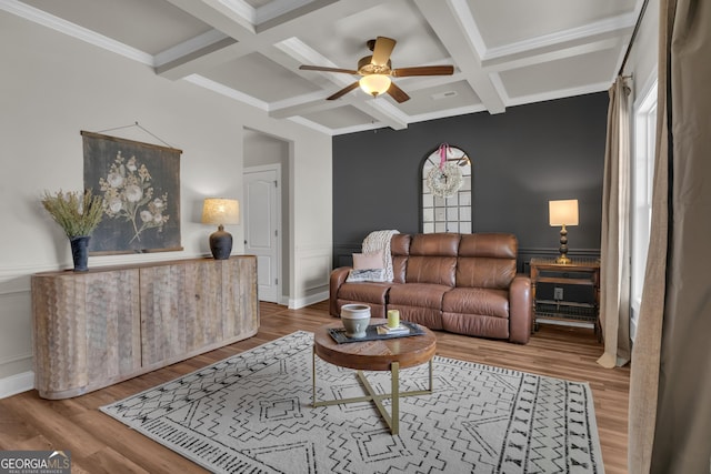 living room with ceiling fan, coffered ceiling, and wood finished floors