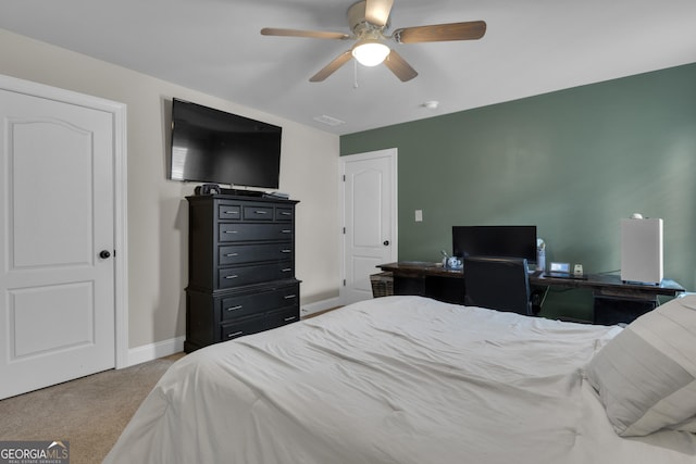 bedroom with baseboards, a ceiling fan, and carpet flooring