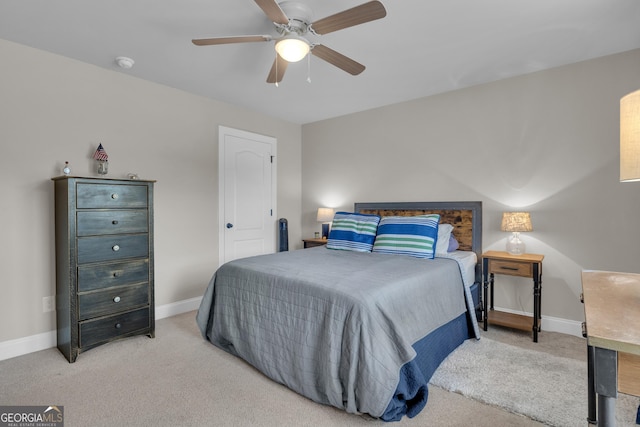 bedroom with baseboards, carpet, and a ceiling fan