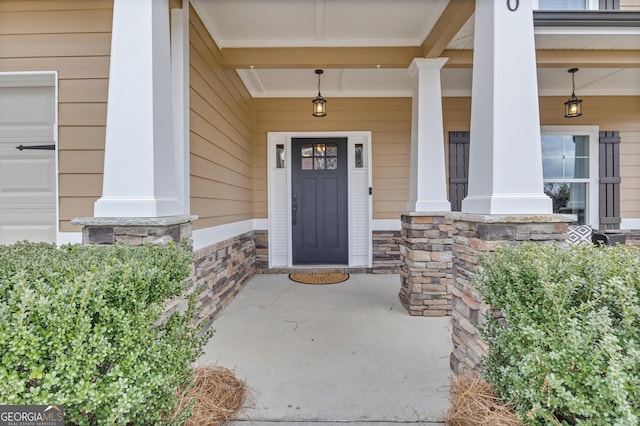 entrance to property featuring a porch